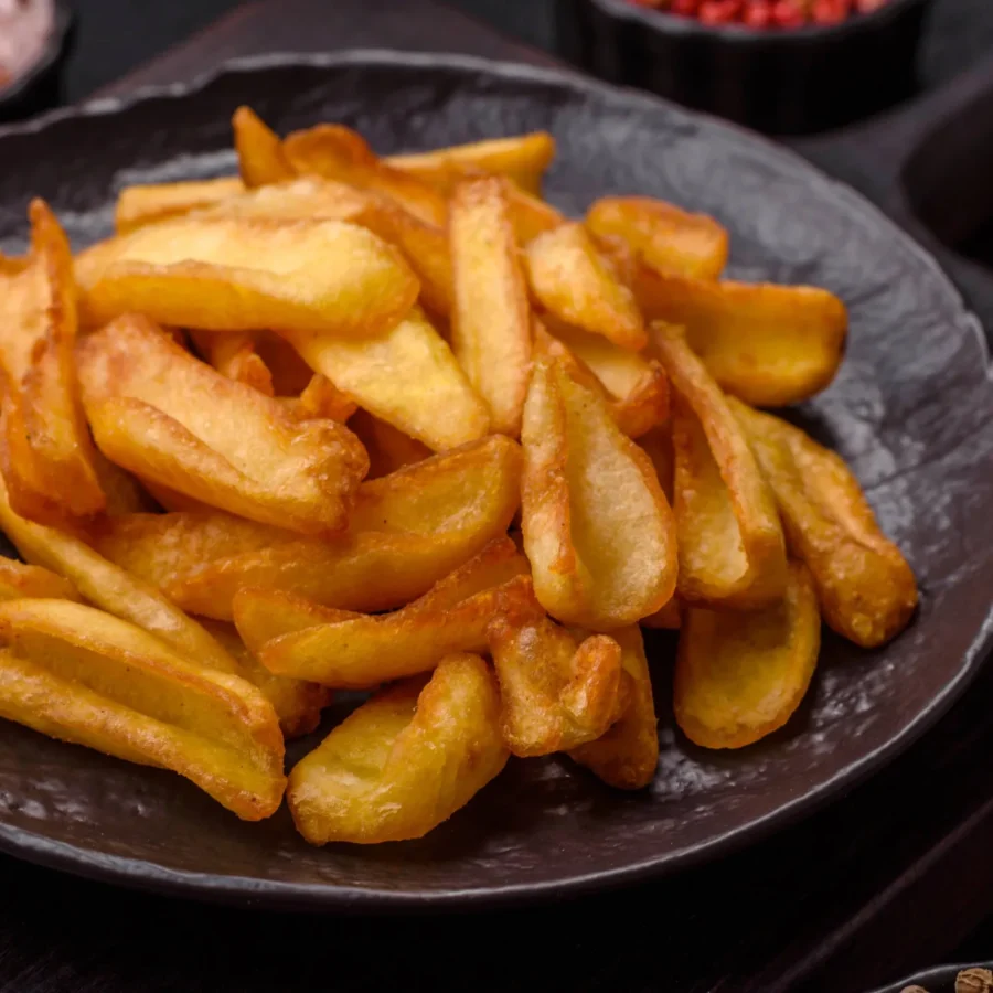 A portion of crispy chips in a black bowl.